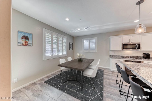 dining room with light hardwood / wood-style floors