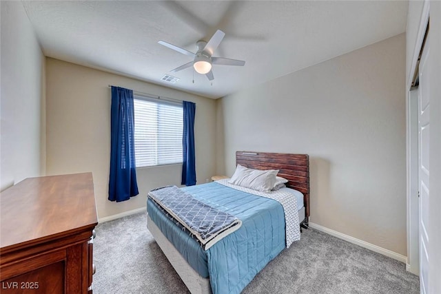 carpeted bedroom with ceiling fan