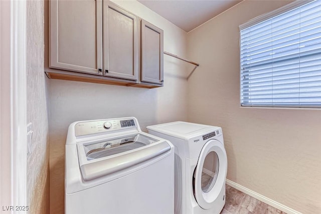 laundry area with cabinets and independent washer and dryer