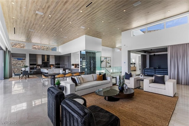 lobby featuring wood ceiling and a high ceiling