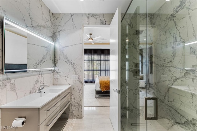 bathroom featuring vanity and a shower with shower door