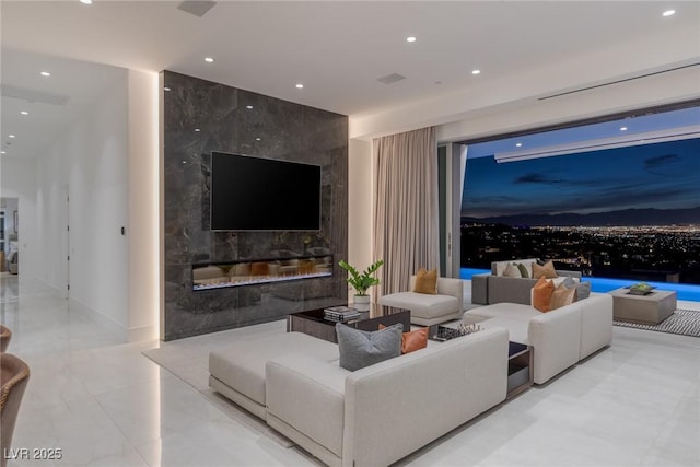 living room featuring a high end fireplace