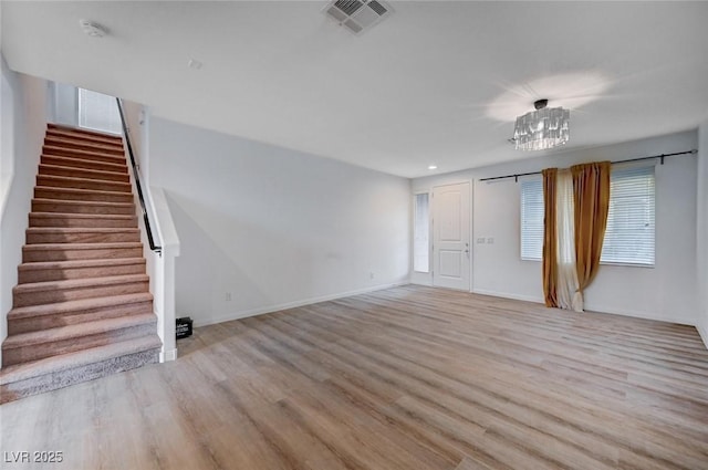 spare room featuring light hardwood / wood-style flooring