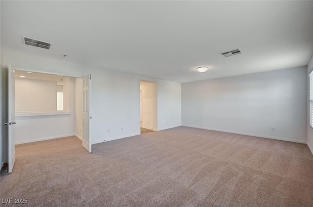 empty room with light colored carpet