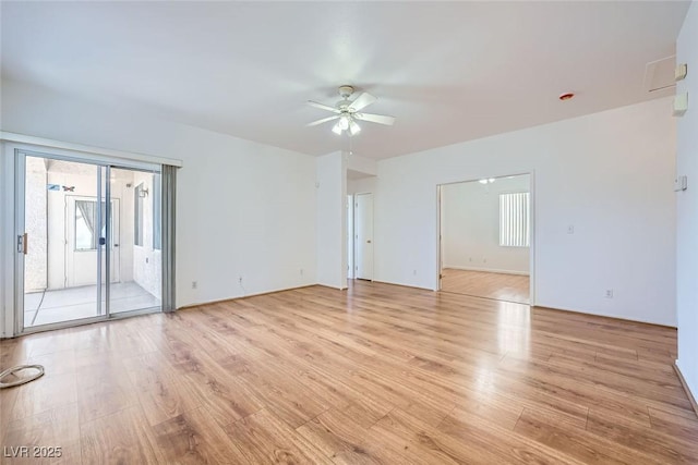 unfurnished room featuring ceiling fan and light wood-type flooring