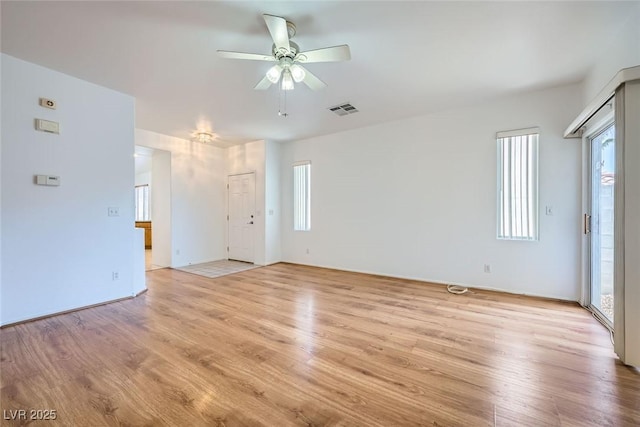 unfurnished room with ceiling fan and light hardwood / wood-style flooring