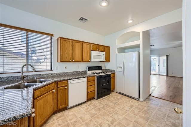 kitchen with white appliances and sink