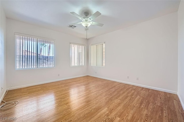 spare room with ceiling fan and light hardwood / wood-style floors