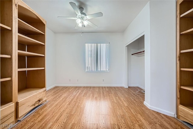 unfurnished bedroom with ceiling fan, light wood-type flooring, and a closet