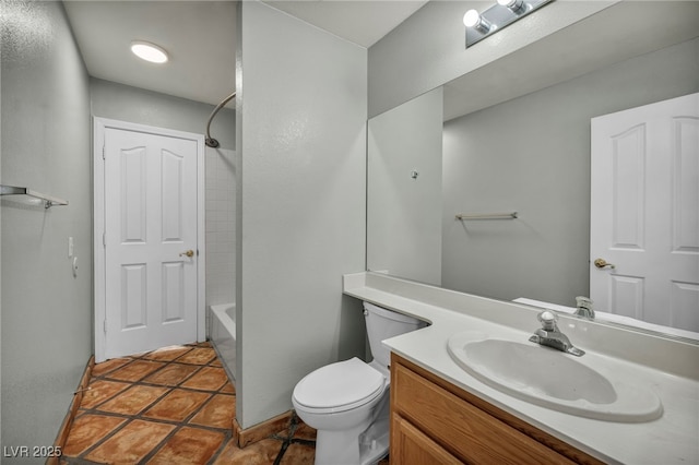 full bathroom featuring vanity, tile patterned flooring, toilet, and shower / bath combination