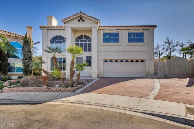 mediterranean / spanish-style home featuring a garage