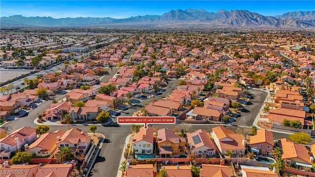 birds eye view of property with a mountain view