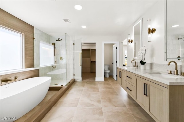 full bathroom with toilet, vanity, shower with separate bathtub, and tile patterned flooring