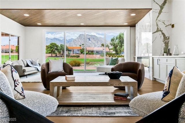 interior space featuring a mountain view, wood ceiling, and a wealth of natural light