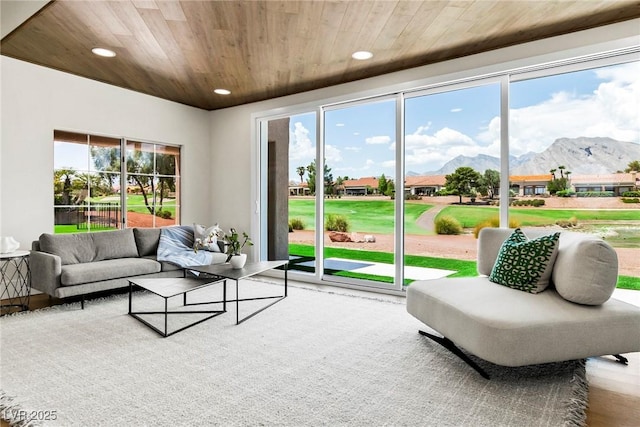 interior space with a mountain view and wooden ceiling