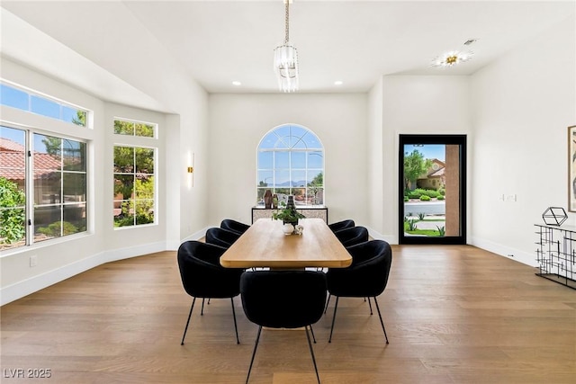 dining room with a chandelier and light hardwood / wood-style floors