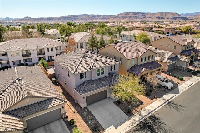 birds eye view of property featuring a mountain view