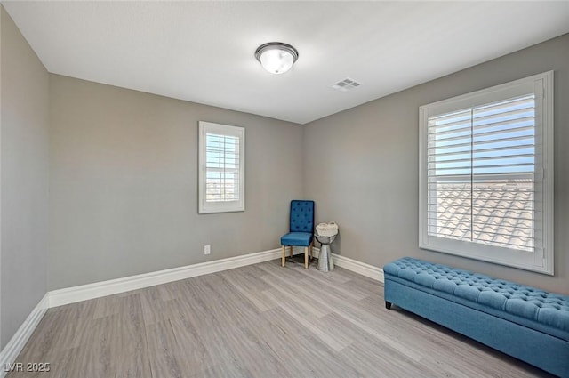 unfurnished room with light hardwood / wood-style flooring