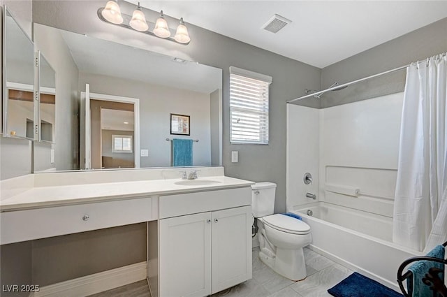 full bathroom with vanity, toilet, and shower / bath combo with shower curtain