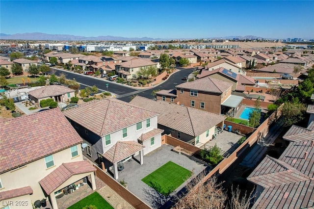 birds eye view of property featuring a mountain view