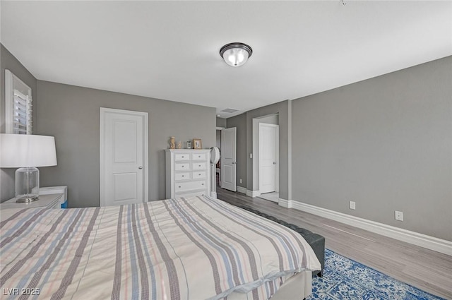 bedroom featuring wood-type flooring