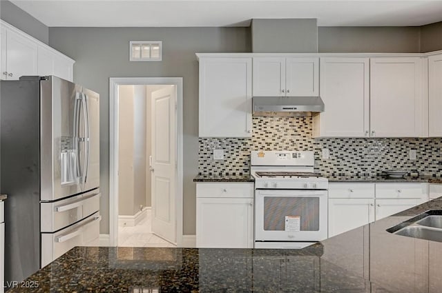 kitchen with extractor fan, stainless steel fridge with ice dispenser, gas range gas stove, and white cabinets