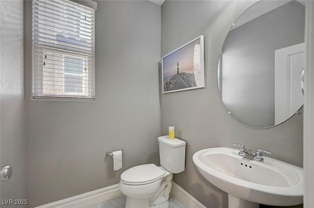 bathroom with sink and toilet