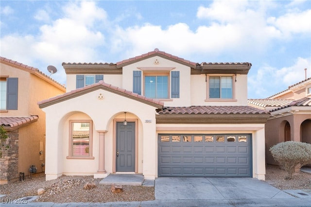 mediterranean / spanish-style house with a garage