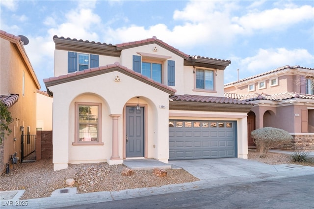 mediterranean / spanish-style house featuring a garage