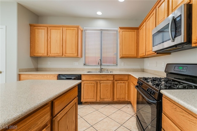 kitchen with sink, light tile patterned floors, and black appliances