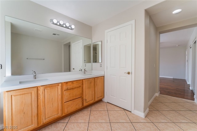 bathroom with vanity and tile patterned floors