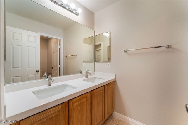 bathroom with tile patterned floors and vanity