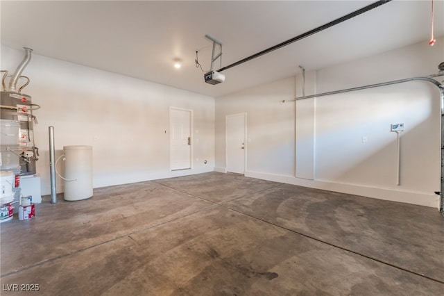 garage featuring a garage door opener and water heater