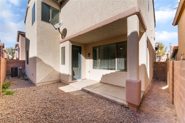 back of house with central AC and a patio area