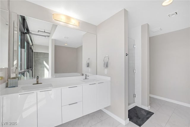 bathroom featuring vanity and a shower with shower door