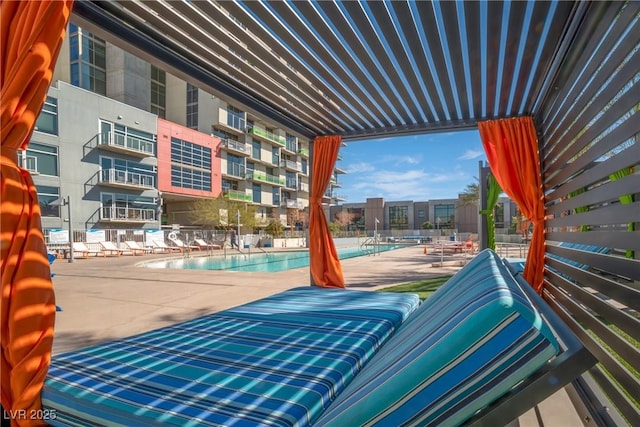 view of patio / terrace featuring a swimming pool