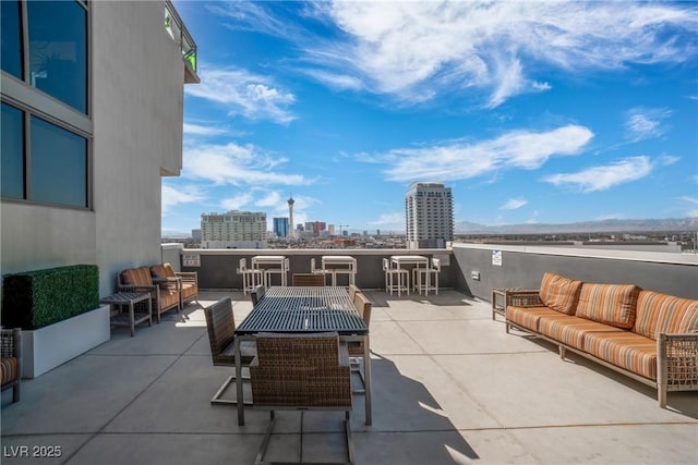 view of patio / terrace with outdoor lounge area and an outdoor bar