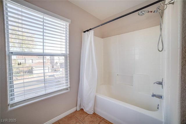 bathroom with shower / bath combination with curtain and tile patterned floors