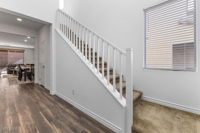 stairs with wood-type flooring