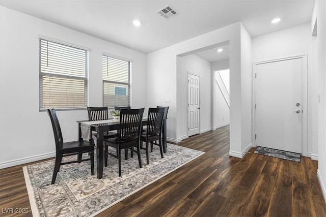 dining room with dark wood-type flooring