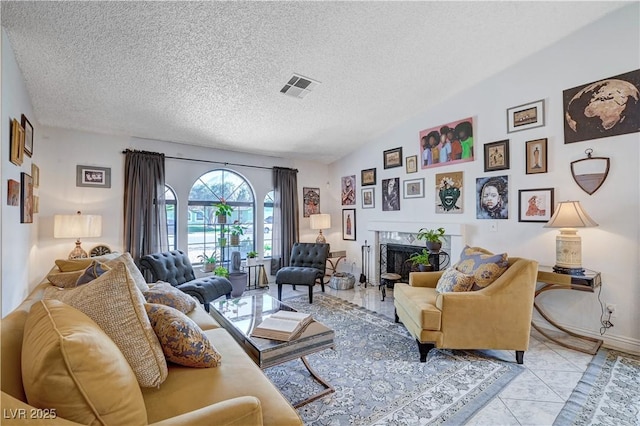 tiled living room with a textured ceiling