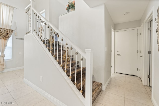 staircase with tile patterned flooring