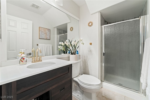 bathroom featuring tile patterned flooring, vanity, an enclosed shower, and toilet