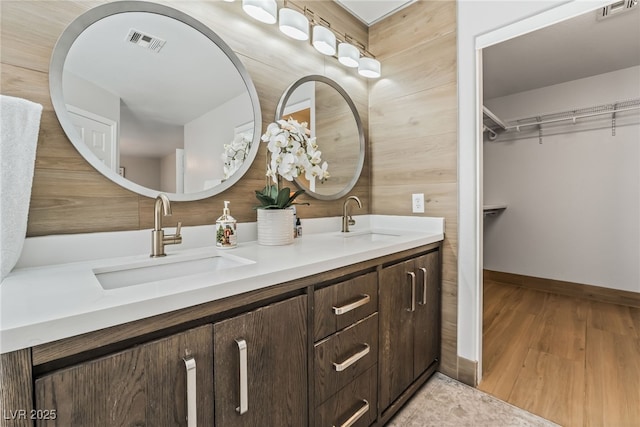 bathroom featuring vanity and wood-type flooring