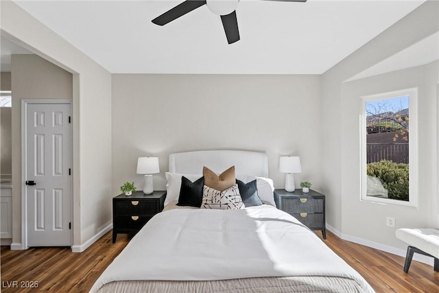 bedroom with dark hardwood / wood-style flooring and ceiling fan