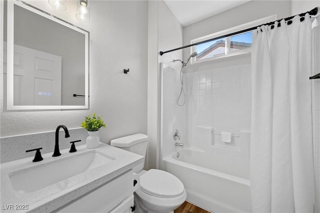 full bathroom with shower / tub combo, vanity, and toilet