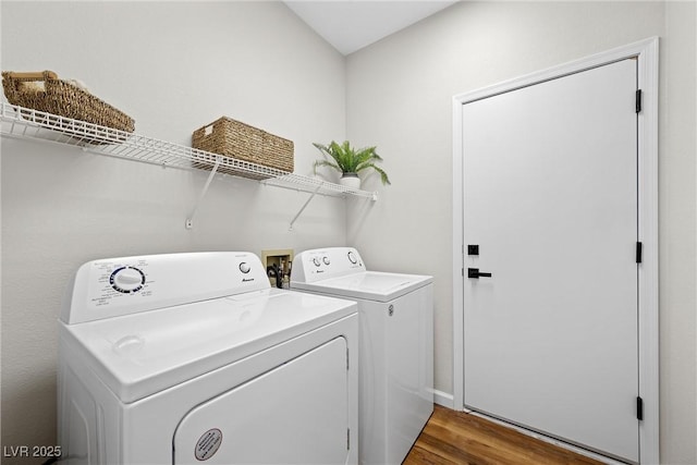 laundry room featuring hardwood / wood-style flooring and independent washer and dryer