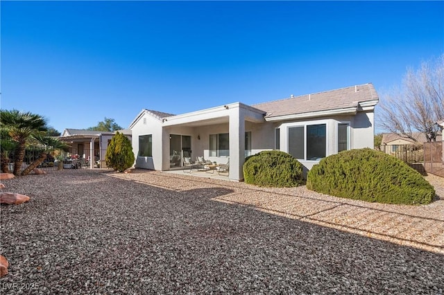 rear view of property with a patio