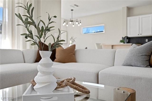 living room featuring a chandelier