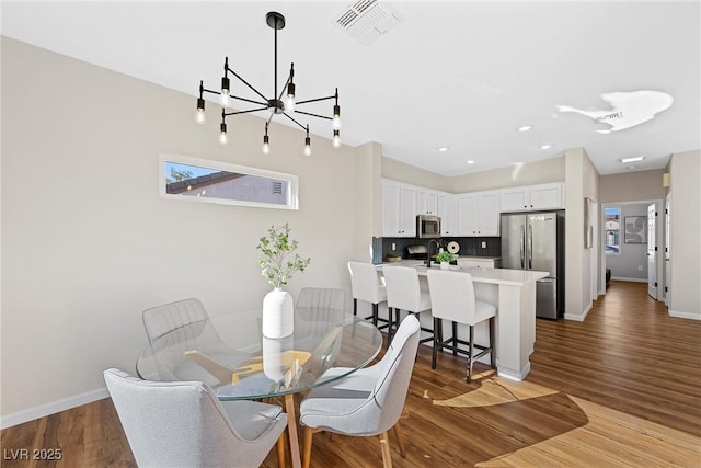 dining room with light hardwood / wood-style flooring